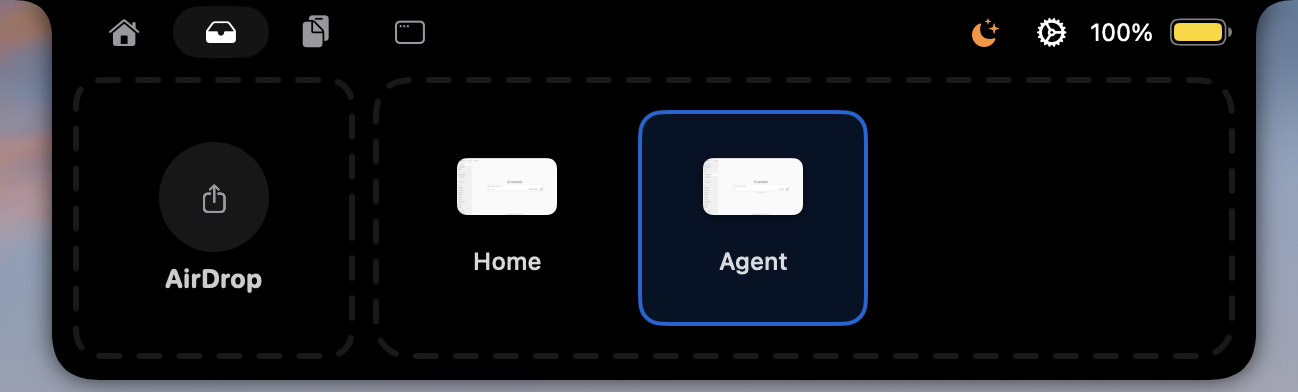 The notch open on the shelf tab: an AirDrop drop target beside two staged files waiting to be dragged out.